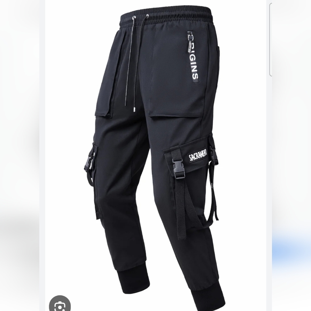 Black Cargo Style, With Pockets And Elastic Hem.